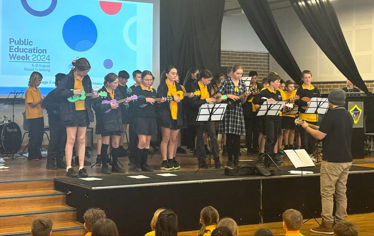 Musical performance by school students with musical instruments